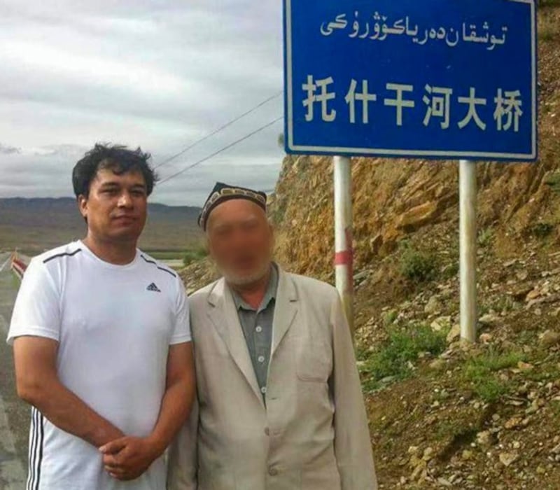 Behtiyar Sadir (L) appears with an unidentified man on a roadway in northwestern China's Xinjiang region in an undated photo. Credit: Behtiyar Sadir's family