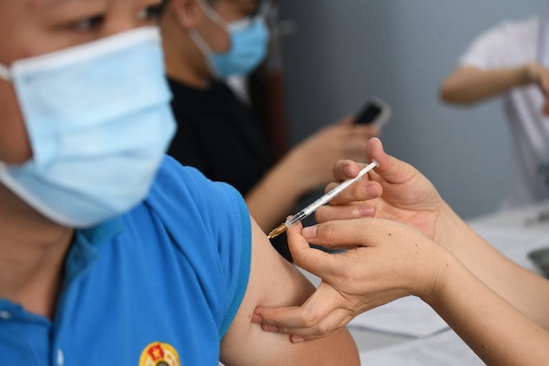 A resident gets vaccinated in Hanoi, May 17, 2021. AFP