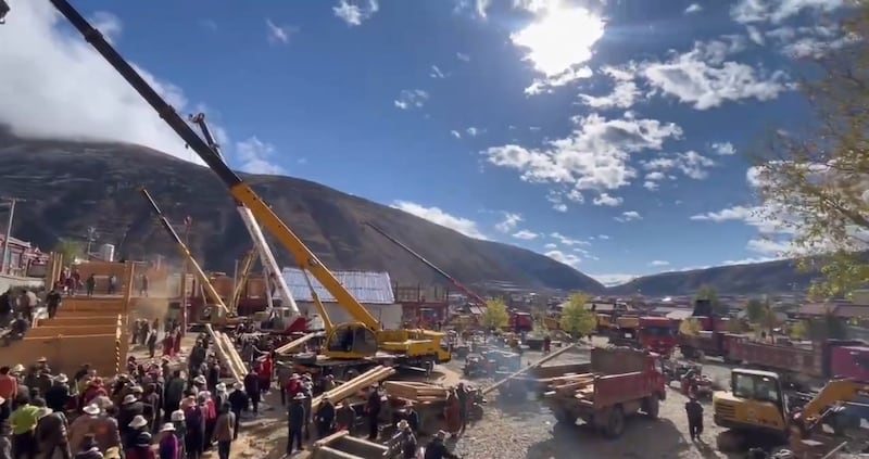 Tibetan volunteers led by monastery officials demolish the Gaden Rabten Namgyaling school at Drago Monastery in Karze (Ganzi) in China's western Sichuan province, in late October. Credit: Kalsang Norbu