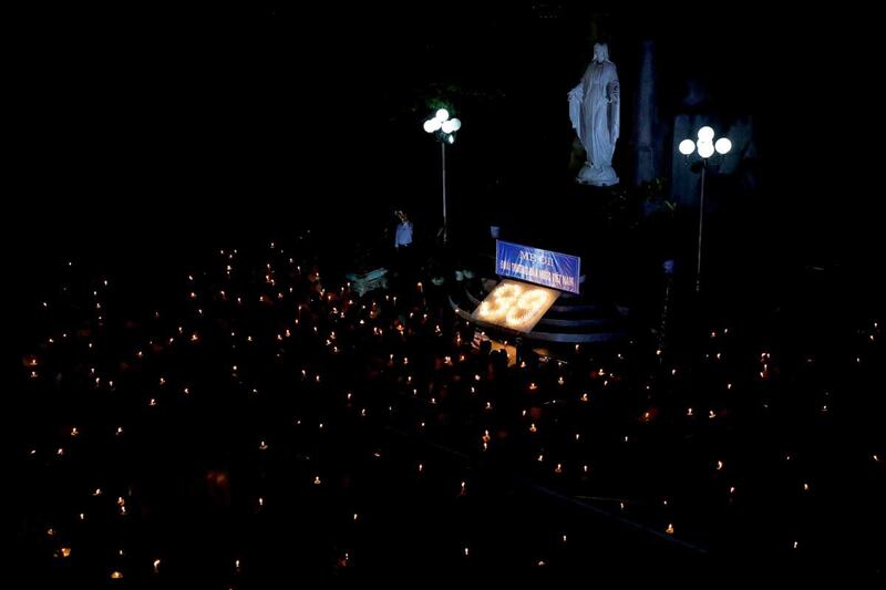 A candlelit mass prayer is held for the victims in Nghe An on Nov. 30, 2019. (Reuters)