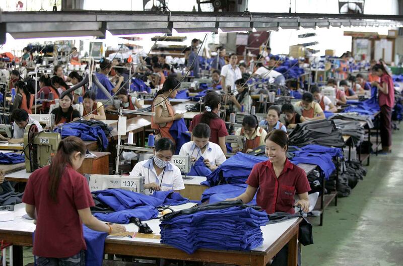 Workers assemble garments to be exported abroad at a factory on the outskirts Vientiane, Laos, May 2, 2006. Credit: Sukree Sukplang/Reuters