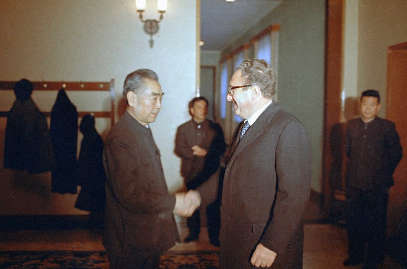 Secretary of State Henry Kissinger greets China's Premier Zhou Enlai before the start of their meeting in Beijing, Nov. 12, 1973. (Harvey Georges/AP)