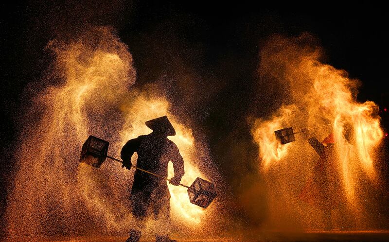 Performers create sparks with molten steel at a lantern festival in Nantong, China, Jan. 27, 2025.