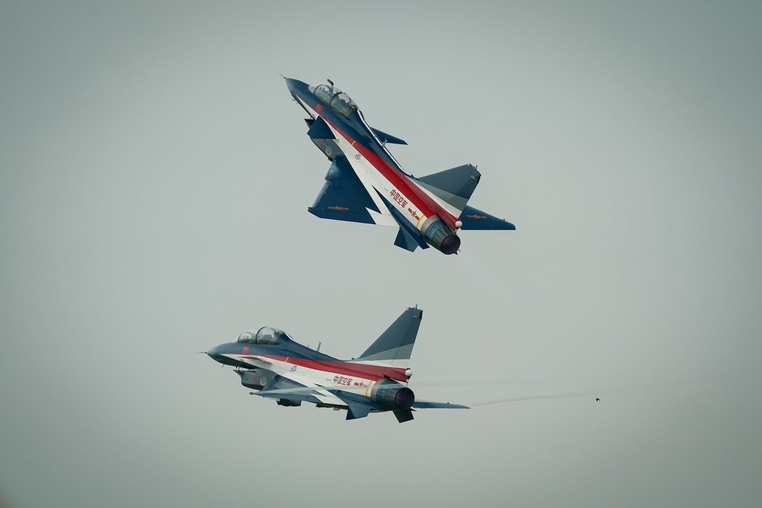 Chinese People’s Liberation Army Air Force Chengdu J-10 jets perform over Don Mueang air base in Bangkok, March 7, 2025.