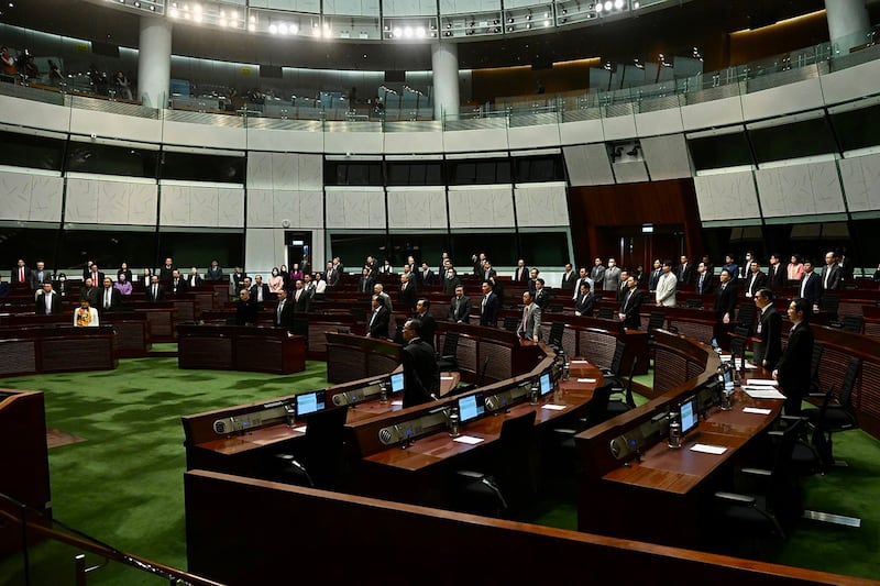 Lawmakers take part in reading the draft of the Safeguarding National Security Bill at the Legislative Council in Hong Kong on March 8, 2024. (Li Zhihua/China News Service/VCG via Getty Images)