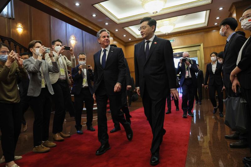 U.S. Secretary of State Antony Blinken, center, left, walks with Chinese Foreign Minister Qin Gang, center right, at the Diaoyutai State Guesthouse in Beijing, China, Sunday, June 18, 2023. (Leah Millis/Pool Photo via AP)