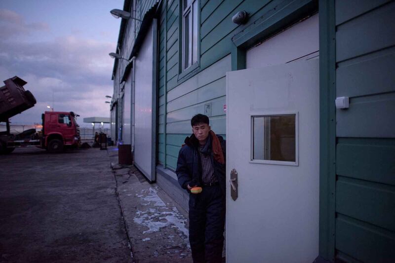 A North Korean worker leaves a warehouse at the joint Russia-North Korea RasonConTrans coal port at Rajin harbor in the northeastern city of Rason, near the borders of both China and Russia, Nov. 20, 2017. Credit: Ed Jones/AFP