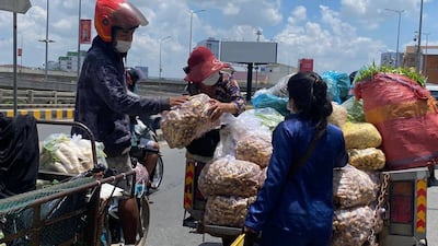 Vegetables are loaded onto truck that will serve as a mobile shop for families under lockdown restriction in Phnom Penh, April 20, 2021.