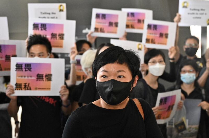 Radio Television Hong Kong (RTHK) producer Bao Choy Yuk-ling (C) arrives at the West Kowloon Courts building in Hong Kong on April 22, 2021, for charges she faced in connection with her research for a documentary on the Yuen Long attacks that took place in July 2019. Credit: AFP