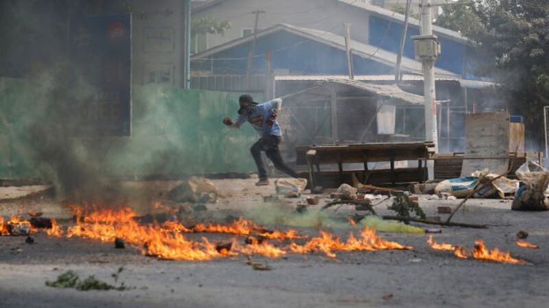 myanmar-man-road-barricade-mandalay-mar22-2021.jpg