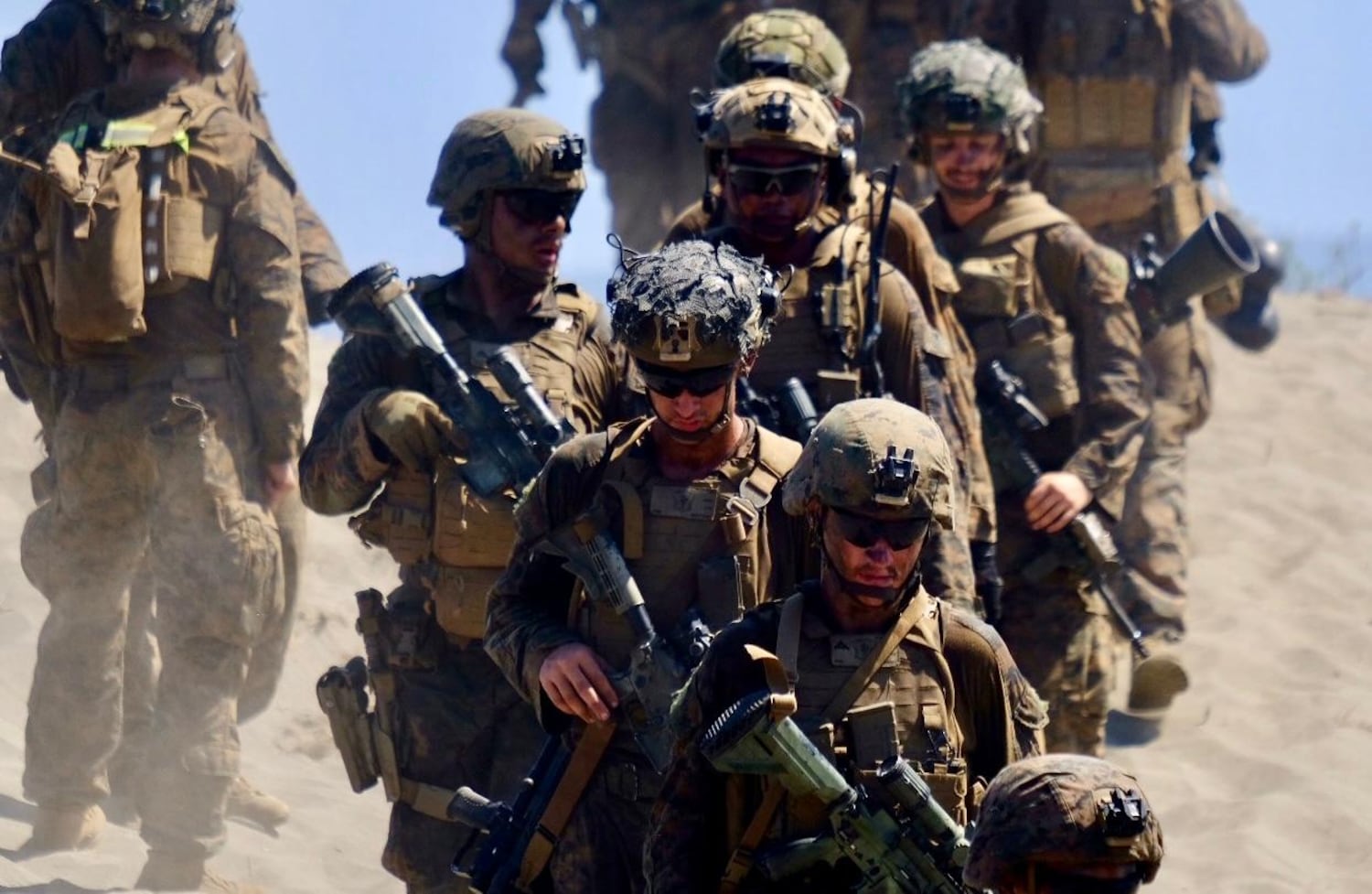 U.S. troops leave a hill on a beach in Laoag city, northern Philippines, during  U.S.-Philippine exercises, May 6, 2024.