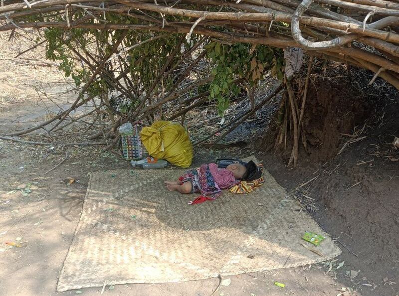 A child sleeps on a mat in the jungle in Sagaing's Kanbalu township in Myanmar, Tuesday, April 18, 2022. Credit: Citizen journalist