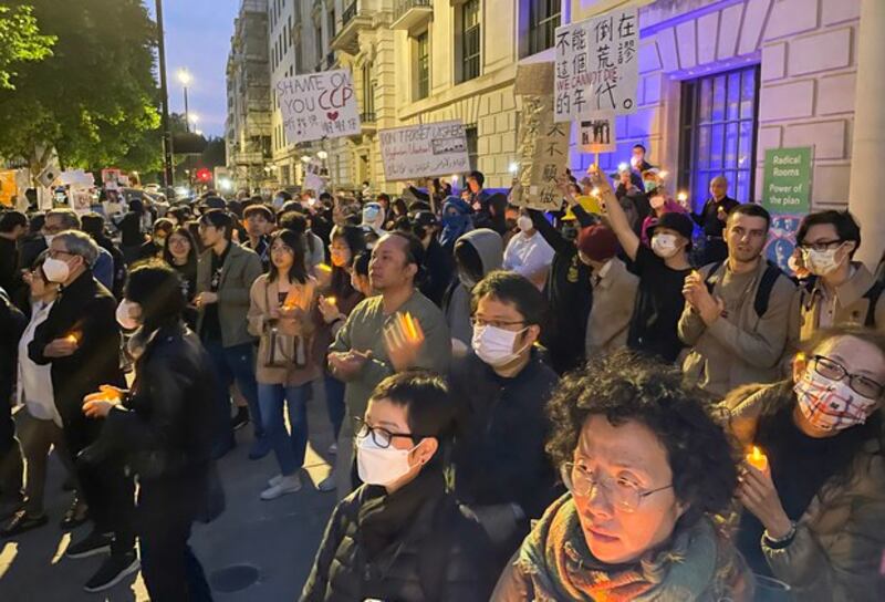 Hongkongers in exile in Britain join mainland democracy activists to mark the 33rd anniversary of the June 4, 1989 Tiananmen massacre in London at the weekend, lighting candles and writing messages of commemoration outside the Chinese Embassy, in London, June 2, 2022. Credit: RFA