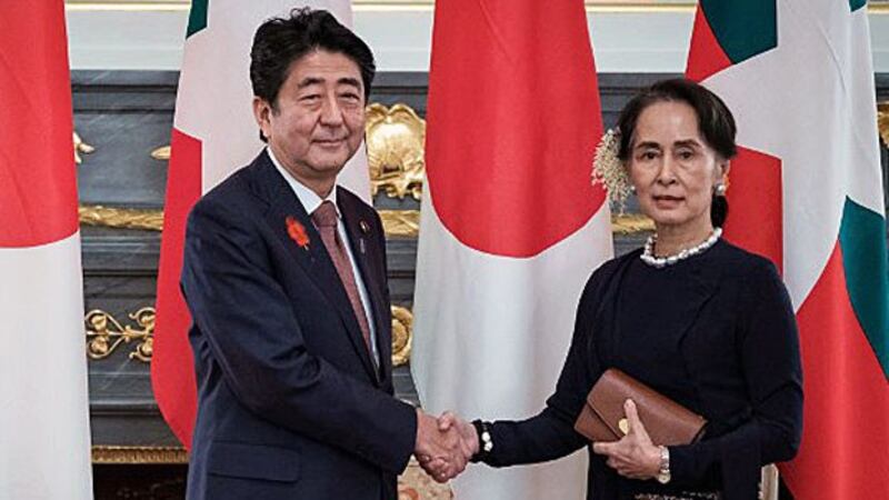 Japan's Prime Minster Shinzo Abe (L) and Myanmar's State Counselor Aung San Suu Kyi (R) meet for a summit at the Akasaka Palace State Guest House in Tokyo, Oct. 9, 2018.