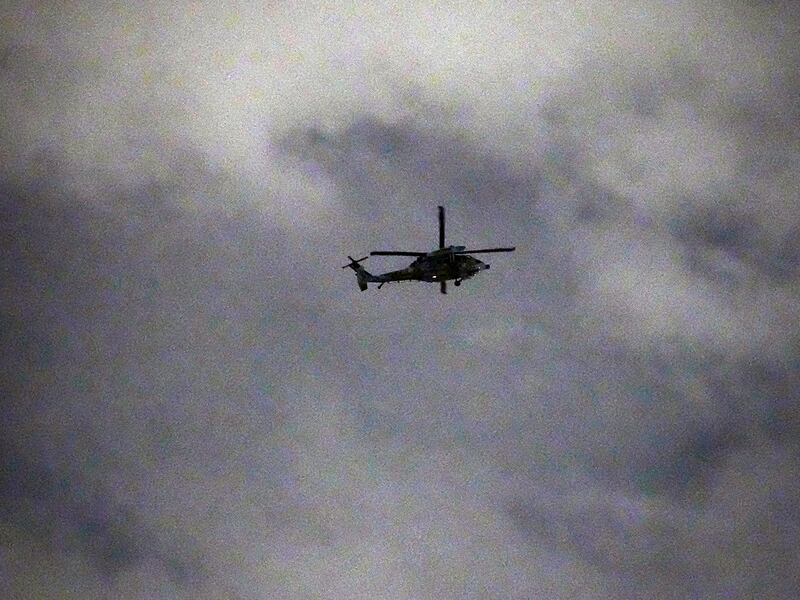 A helicopter flies over the National Assembly in Seoul, Dec. 4, 2024.