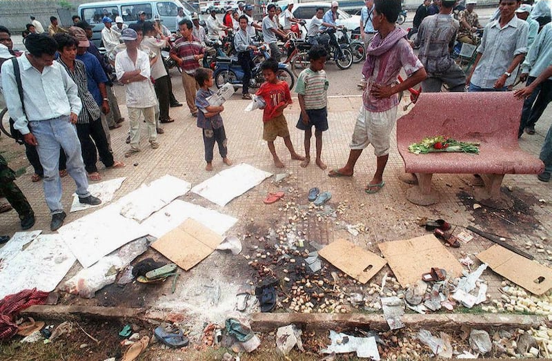 Cambodians gather at the site of a grenade attack on a group of demonstrators outside the National Assembly building in Phnom Penh, March 31, 1997. Credit: AFP