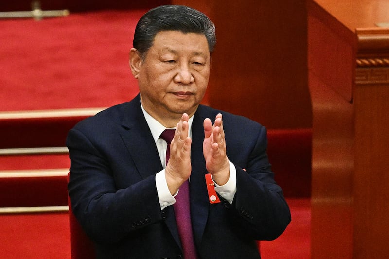 China’s President Xi Jinping applauds during the closing session of the National People's Congress in Beijing, March 11, 2025.