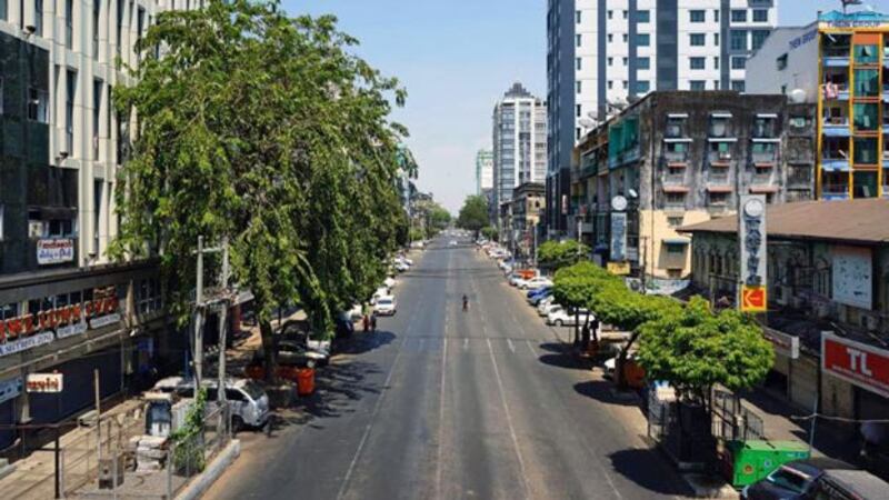 A usually busy street in Myanmar's commercial hub Yangon is devoid of pedestrians and traffic amid a lockdown to prevent the spread of COVID-19 during the Buddhist New Year, April 15, 2020.