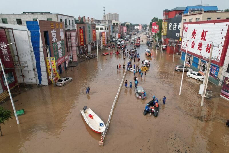 Rescue teams work in a flooded village after heavy rains in Zhuozhou, Baoding city, in northern China's Hebei province on Aug. 2, 2023. Credit: Jade Gao/AFP