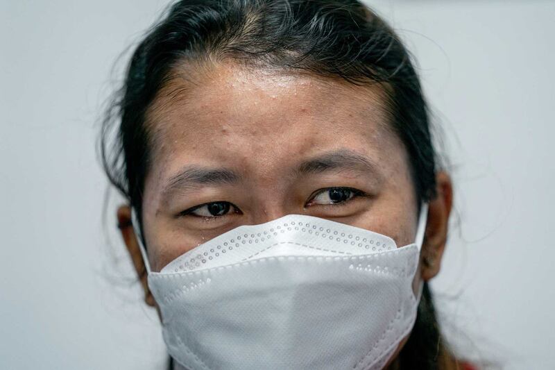 Myanmar migrant worker Ei Nge's eyes fill with tears as she explains the abuse she said she suffered at the hands of her former employers. Photo by Gemunu Amarasinghe