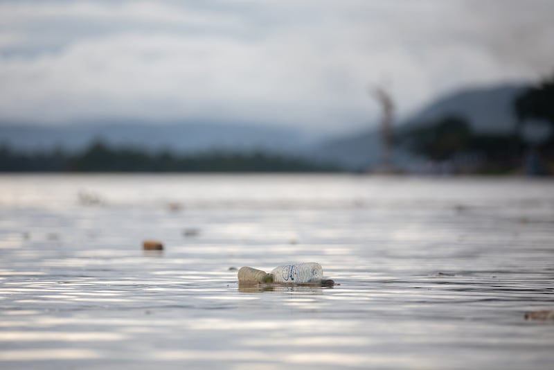 Trash floats down the Ruak River into the Mekong River near the Golden Triangle region between Myanmar, Laos and Thailand.