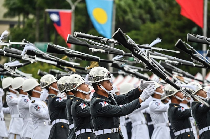 Taiwanese honor guards perform to mark the island's National Day in front of the Presidential Office in Taipei, Taiwan, Oct. 10, 2022. Credit: AFP