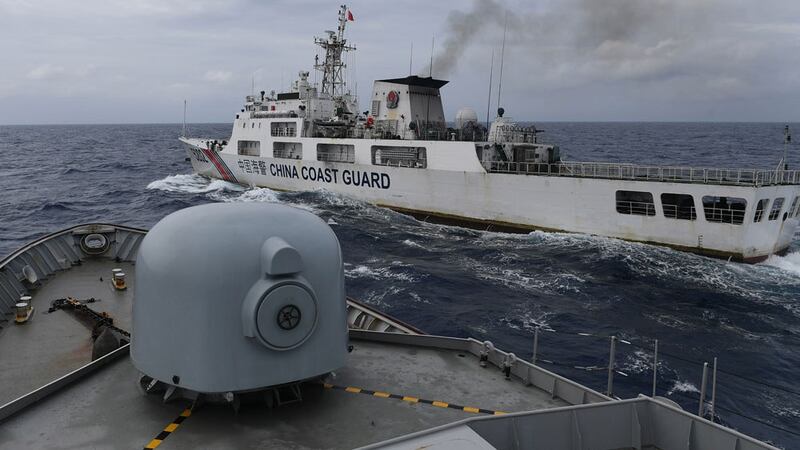 China Coast Guard ship is seen from an Indonesian Naval ship during a patrol at Indonesia's Exclusive Economic Zone sea in the north of Natuna island, Indonesia, Jan. 11, 2020.