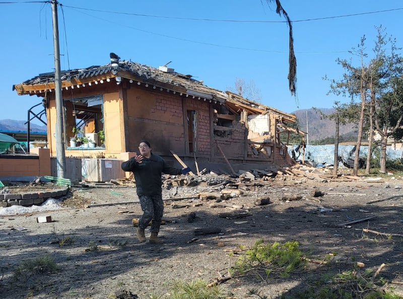 A South Korean soldier gestures near a bomb accident site outside a military live-fire training range in Pocheon on March 6, 2025.