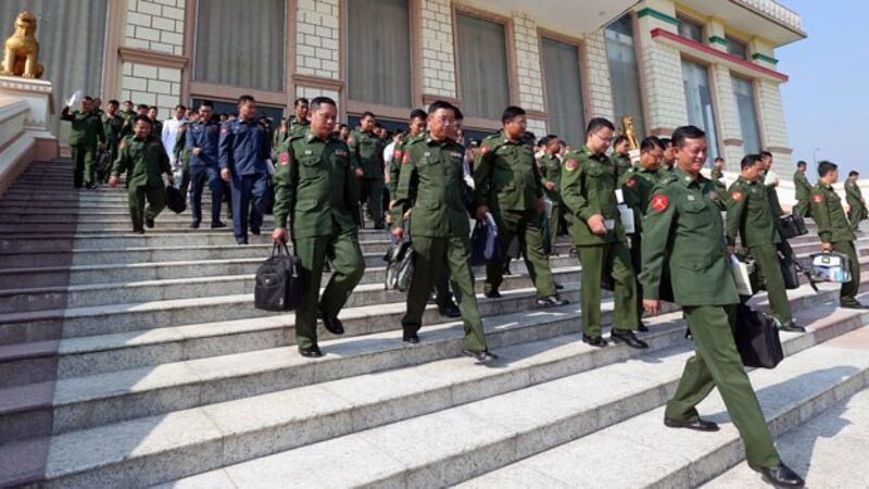 Myanmar military lawmakers leave parliament after a vote to set up a committee to amend the country’s 2008 constitution, in Naypyidaw, Jan. 29, 2019. 