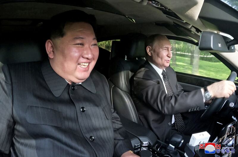 Russia's President Vladimir Putin and North Korea's leader Kim Jong Un ride an Aurus car in Pyongyang, North Korea in this image released by the Korean Central News Agency June 20, 2024.