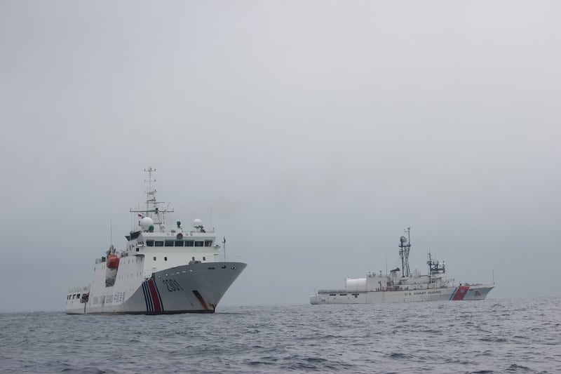 The crew of the U.S. Coast Guard's ship Alex Haley transfers custody of a detained Chinese fishing vessel to China Coast Guard patrol vessel 2301 in the Sea of Japan, June 21, 2018. Credit: U.S. Coast Guard