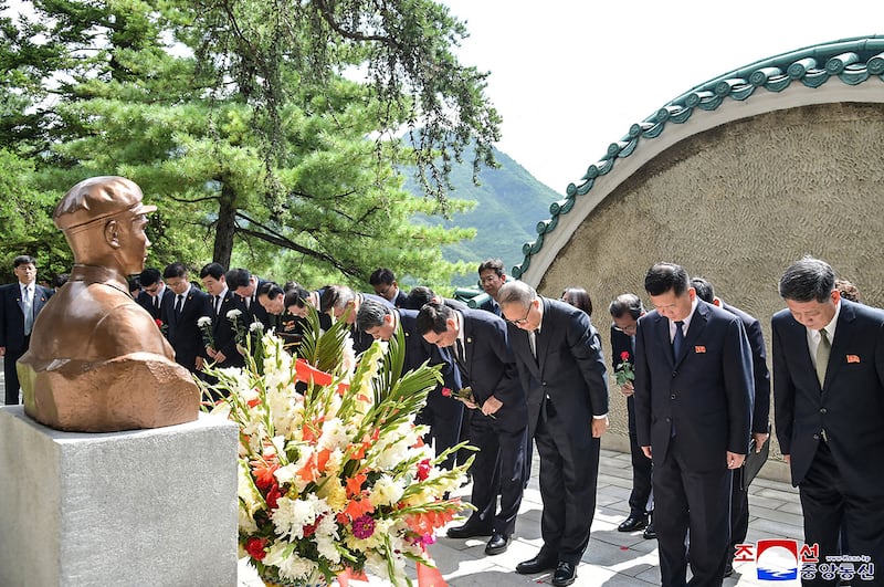 China's Communist Party politburo member Li Hongzhong, third from right, pays his respects at a memorial to former Chinese leader Mao Zedong's son, Mao Anying, in South Pyongan province, North Korea.