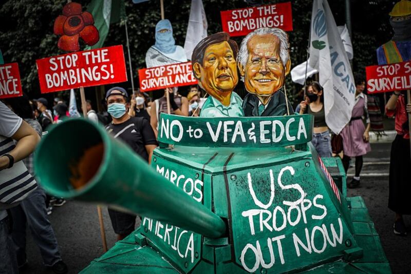 Filipino activists show their displeasure at newly expanded military ties between the Philippines and the U.S. during street protests in Quezon City, Metro Manila, ahead of President Ferdinand Marcos Jr.'s State of the Nation Speech to Congress, July 24, 2023. Credit: Jojo Riñoza/BenarNews