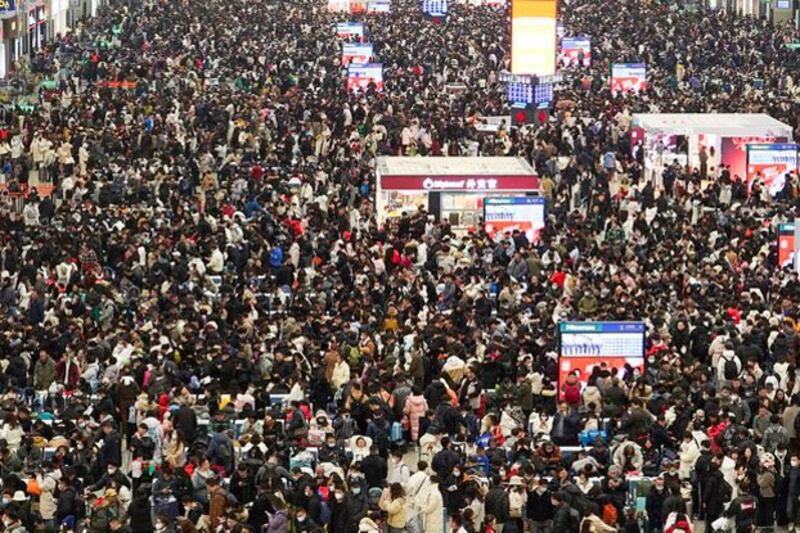 Travelers wait for their trains at Shanghai Hongqiao railway station in Shanghai, China, Feb. 7, 2024. (Nicoco Chan/Reuters)