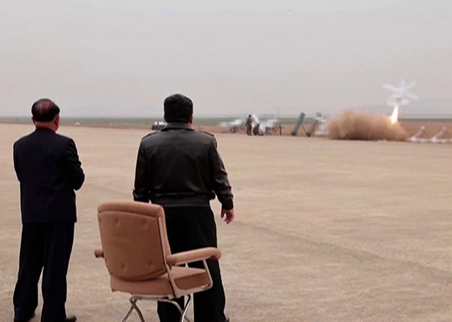 North Korean leader Kim Jong Un, right, watches a drone launch in this image published Nov. 15, 2024. Blurring in image is from source.