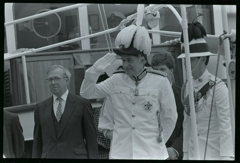 Sir David Wilson wears a plumed ceremonial hat as he salutes the Gurkha honour guard shortly before being sworn in as Hong Kong's new governor.  April 9, 1987 REUTERS/Andrew Wong 87139038  CEREMONY ENGLAND GOVERNOR HAT HONG KONG HONOR GUARD SALUTING; Wilson, David  David Wilson  DISCLAIMER: The image is presented in its original, uncropped, and untoned state. Due to the age and historical nature of the image, we recommend verifying all associated metadata, which was transferred from the index stored by the Bettmann Archives, and may be truncated.