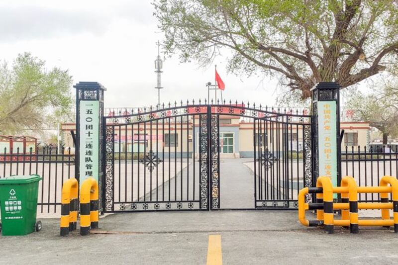 The main gate of a Xinjiang Production and Construction Corps building in Manas County, northwestern China's Xinjiang Uyghur Autonomous Region, April 17, 2021. (Charlie Qi via Wikipedia)