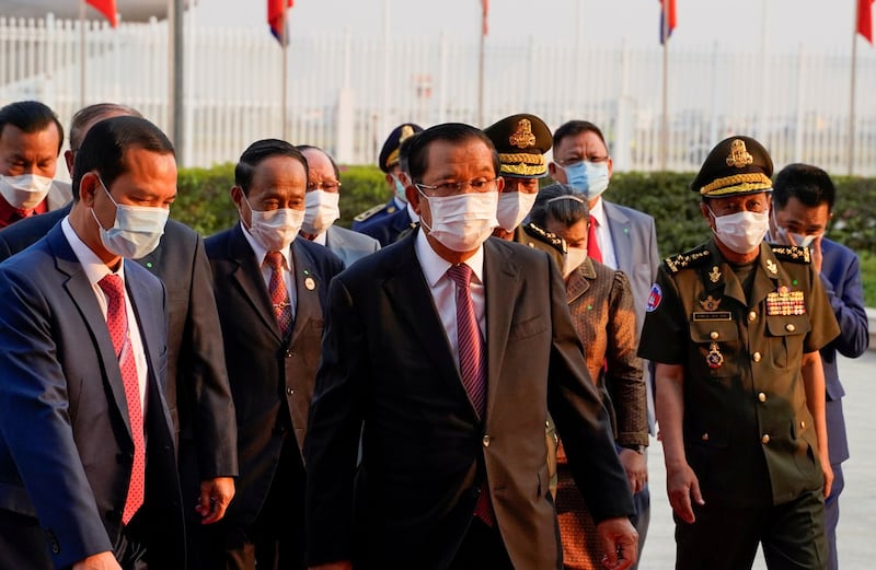 Cambodian Prime Minister Hun Sen arrives to receive a shipment of 600,000 doses of the coronavirus disease (COVID-19) vaccines donated by China from ambassador Wang Wentian, at the Phnom Penh International Airport, in Phnom Penh, Cambodia February 7, 2021. Reuters