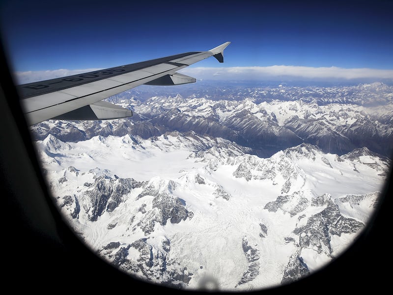 An airplane descends over mountains towards Lhasa, Tibet, Nov. 16, 2015 .