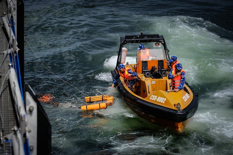 The Philippine Coast Guard deploys a motorized rubber boat during a rescue drill with the Vietnamese Coast Guard west of Corregidor Island, Aug. 9, 2024. (Jojo Riñoza/BenarNews)