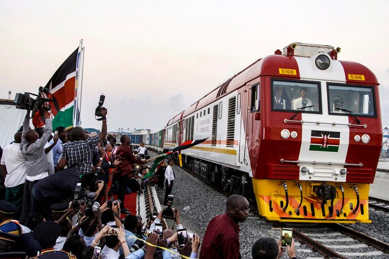 In this May 30, 2017, file photo, the SGR cargo train travels from a port container depot on a Chinese-backed railway costing nearly $3.3 billion - one of the country's largest infrastructure projects since independence - in Mombasa, Kenya. In the past couple of years, Beijing has become more conservative in its approach to its African investments, says Joseph Asunka, CEO of pollsters Afrobarometer. Credit: AP