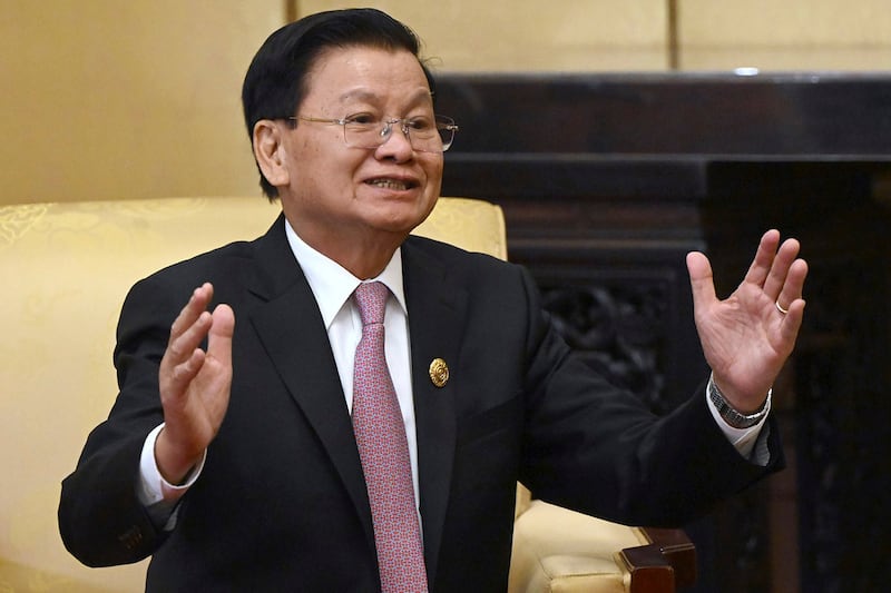 Laos' President Thongloun Sisoulith gestures while speaking to Russian President Vladimir Putin during their meeting on the sidelines of the Belt and Road Forum in Beijing, Oct. 17, 2023. (Sergei Guneyev/Sputnik/Kremlin pool via AP)