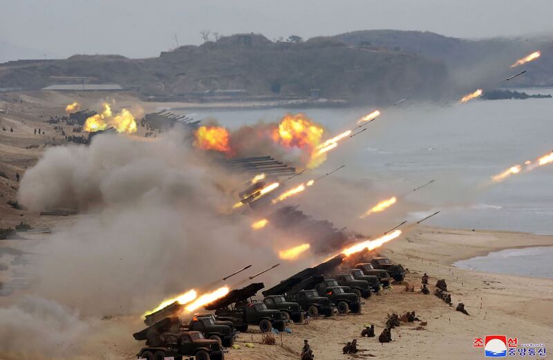 This picture taken on February 28, 2020 and released from North Korea's official Korean Central News Agency (KCNA) on February 29 shows rockets and artillery being fired during a Korean People's Army joint strike drill at an undisclosed location.