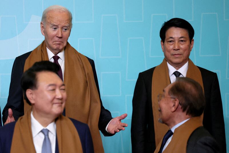 U.S. President Joe Biden reacts as he arrives to pose for a family photo with Vietnam's President Luong Cuong, South Korea's President Yoon Suk Yeol and Malaysia's Prime Minister Anwar Ibrahim during the APEC summit in Lima, Peru, November 16, 2024.