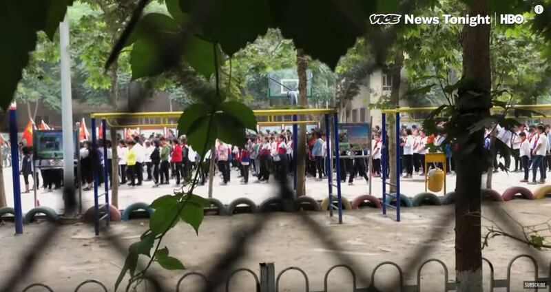 A screen grab from Isobel Yeung's video report shows children reciting propaganda at a 'kindergarten' in Hotan. Credit: Vice News/HBO