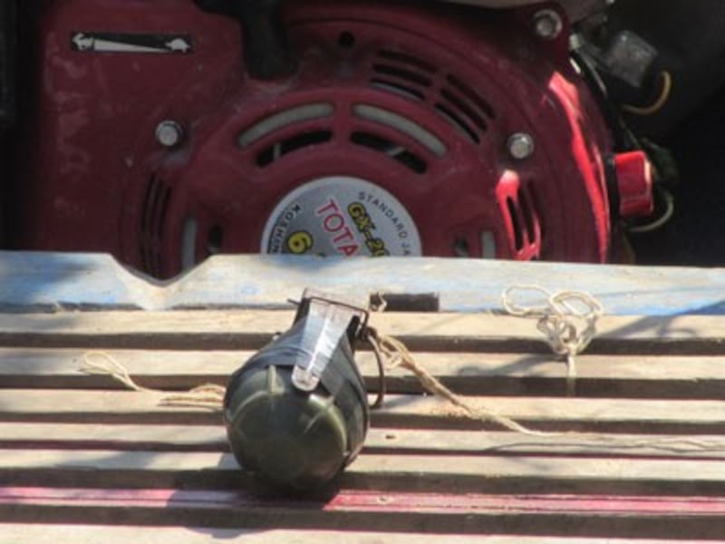 A grenade tied to activist Kuy Saroeun's boat in Siem Reap province, Feb. 6, 2015. Credit: RFA