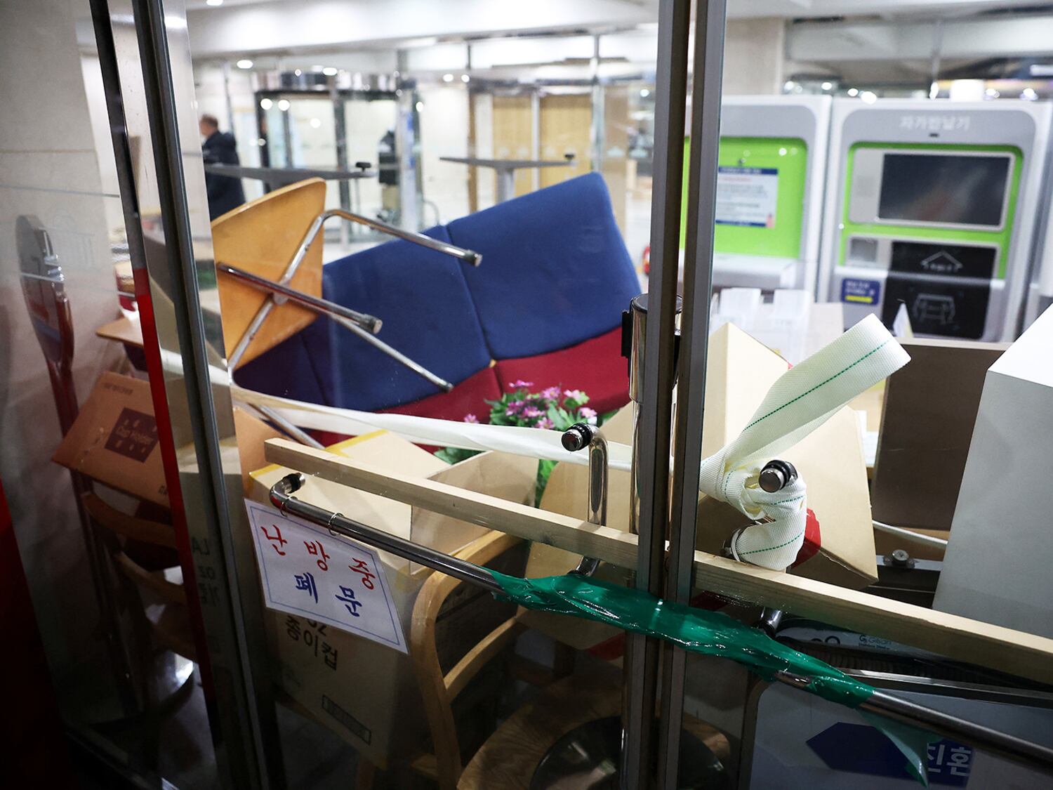 Furniture and boxes are piled up to barricade the entrance doors of the National Assembly, after South Korean President Yoon Suk Yeol declared martial law, in Seoul, Dec. 4, 2024.