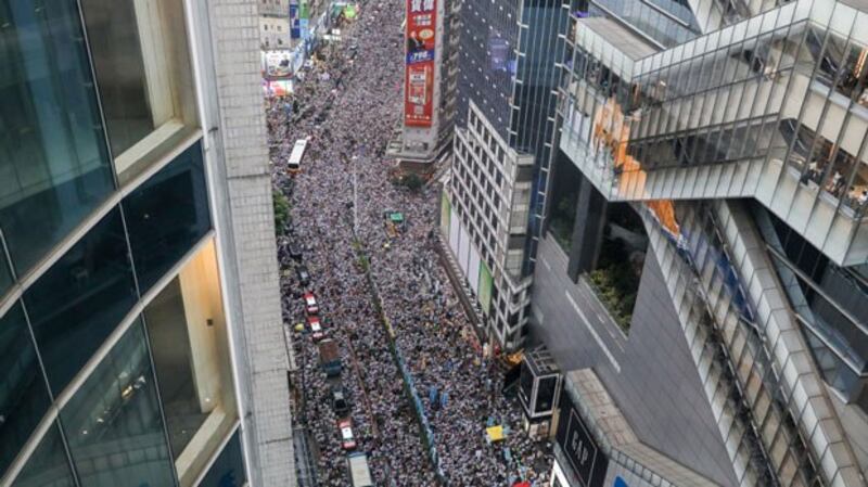 Protesters march during a rally against a controversial extradition law proposal in Hong Kong, June 9, 2019. 