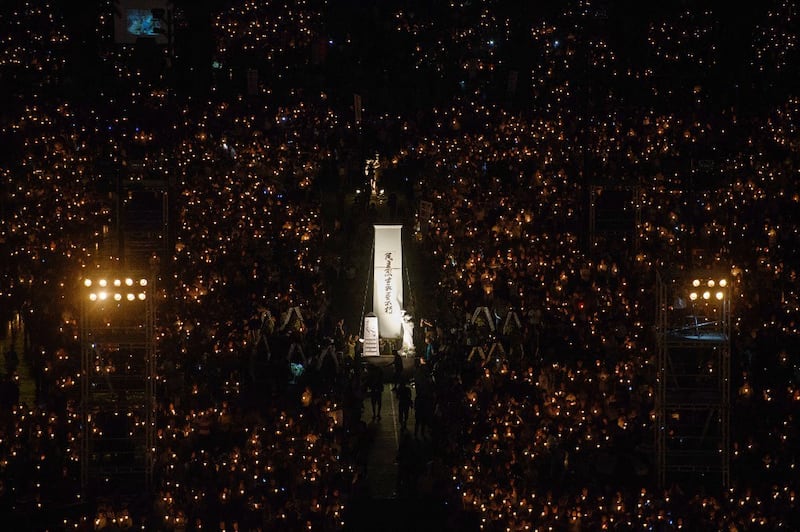 People hold candles during a vigil in Hong Kong on June 4, 2018, to mark the 29th anniversary of the 1989 Tiananmen crackdown in Beijing. Credit: AFP