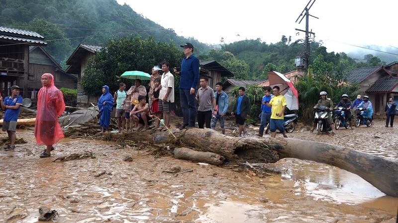 Residents of Oudomxay province watch recovery efforts in the aftermath of Ma-On tropical storm. Credit: Radio and Television of Oudomxay province